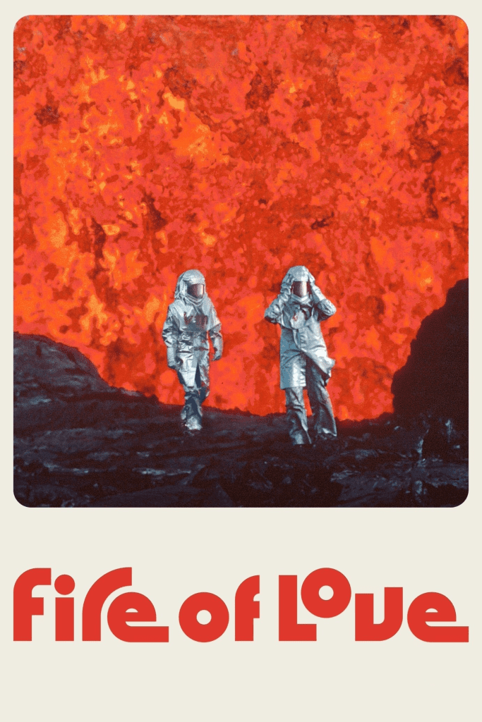 Man and Woman in silver heat reflective suits on the edge of a volcano with a massive lava shoot with writing saying fire of love.